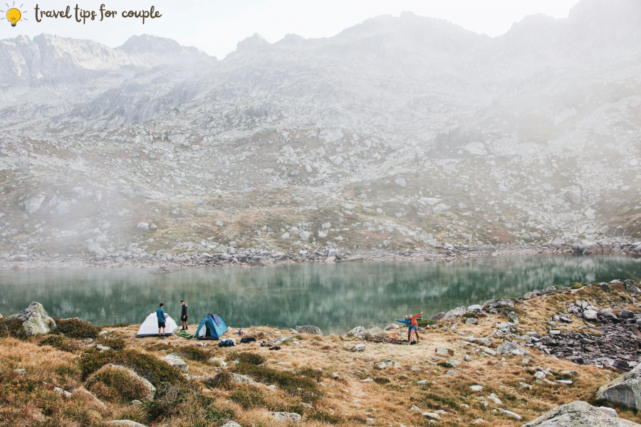Travel tips for couples camping by a mountain lake on their first adventure together